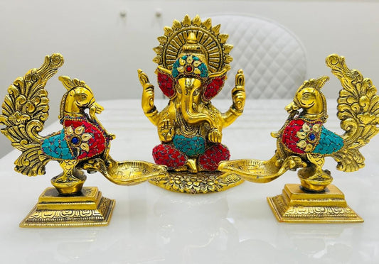 Ganesha with peacock diya