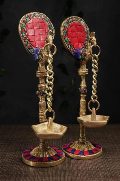 Brass peacock lamp with hanging Diya