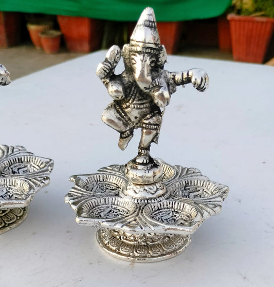 German silver antique dancing ganesh diya pair