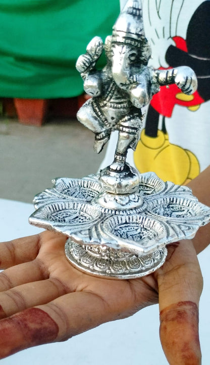 German silver antique dancing ganesh diya pair