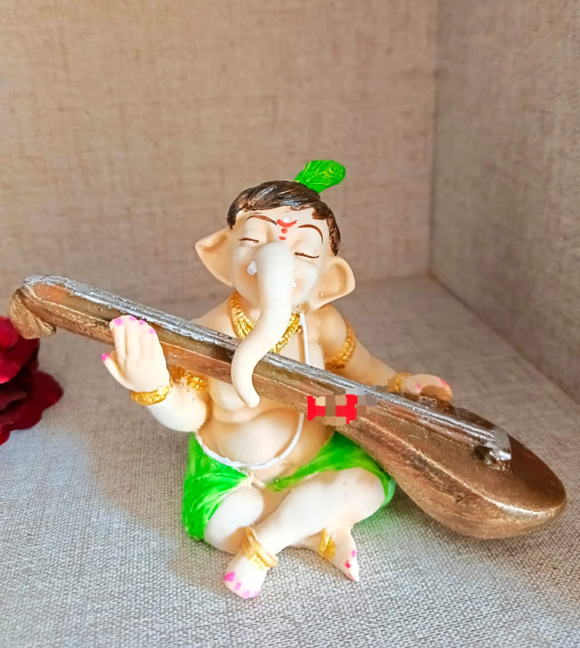 Ganesha playing veena