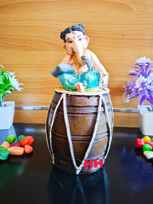 Ganesha sitting on dhol