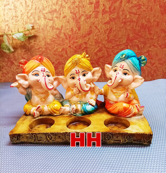 Three baby Ganesha with tea light holder